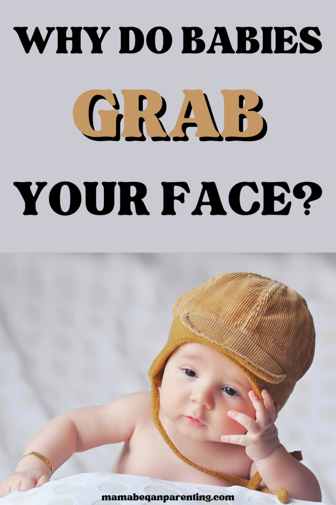why do babies grab your face