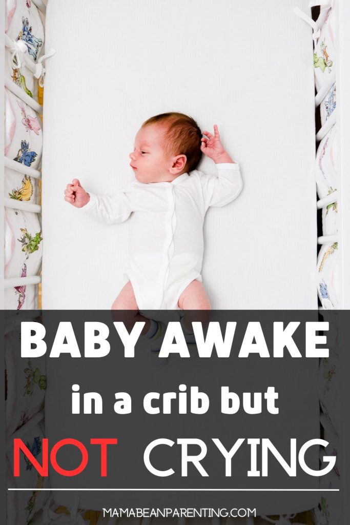 baby awake in a crib but not crying