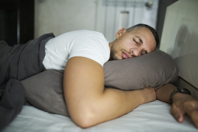 Sleeping with Arms Under Pillow