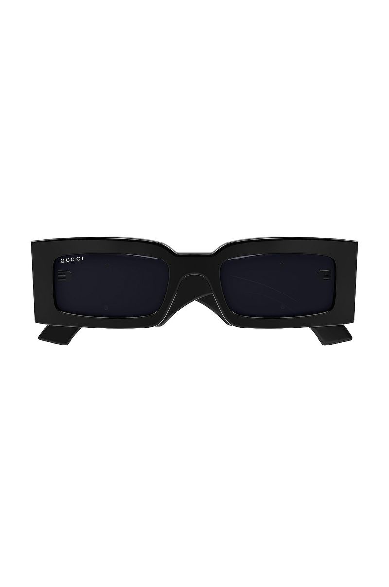 Tiny Sunglasses Over Oversized Frames