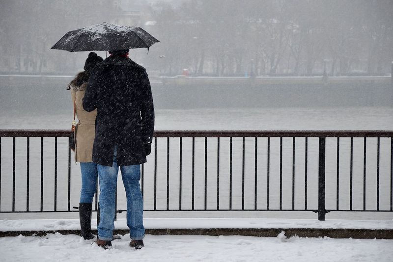 Shared Umbrella in a Storm