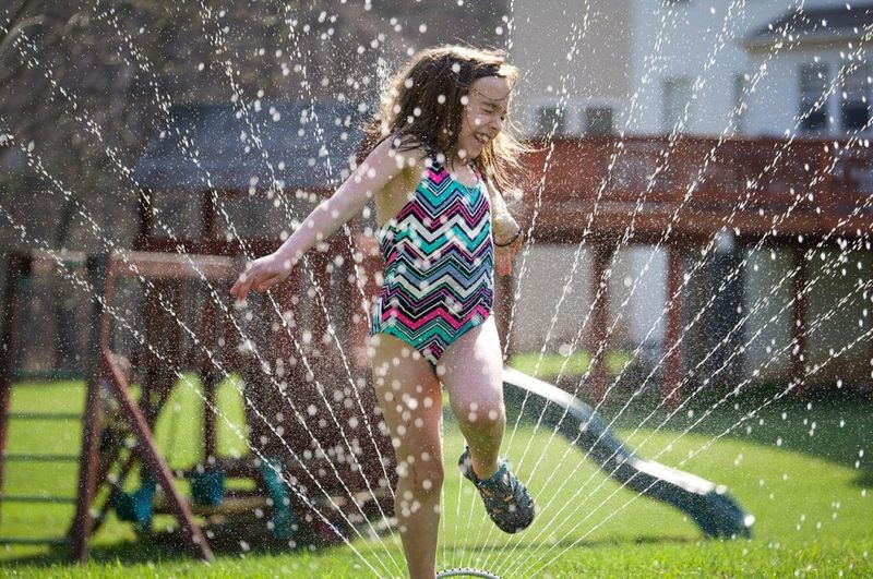 Playing in Sprinklers